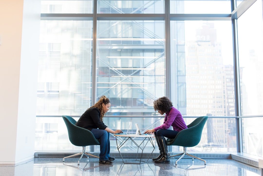 Two colleagues in conversation representing difficult conversations training