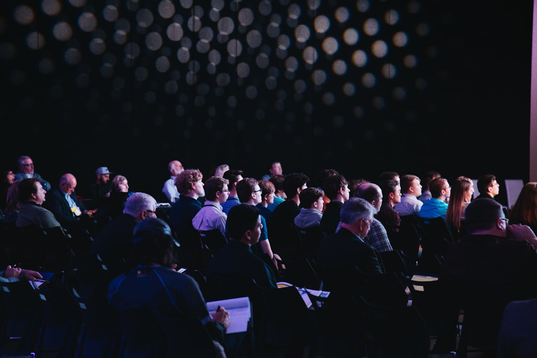 Corporate event audience representing hybrid events and live streaming