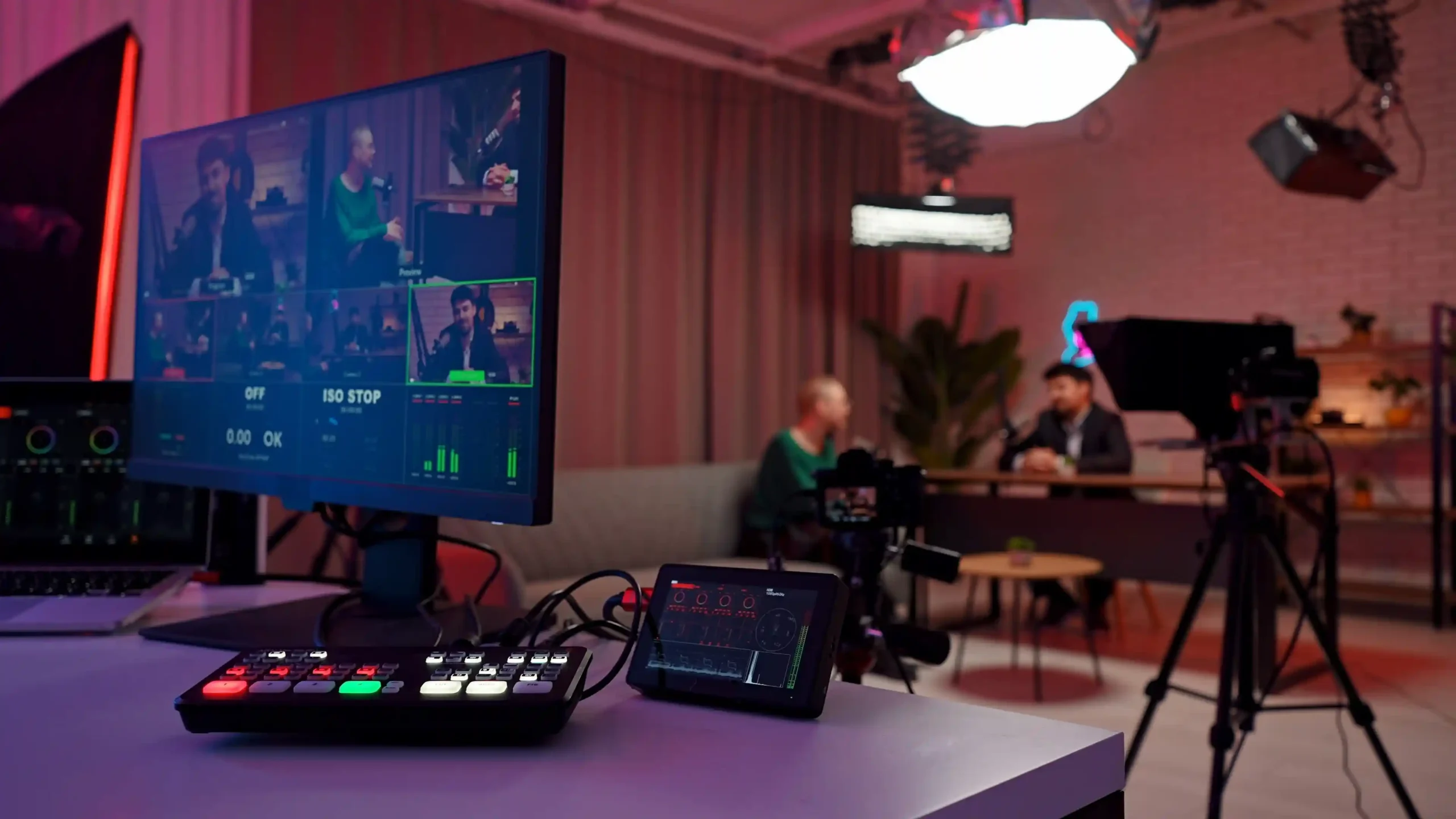 Professional broadcast control setup with cameras and production monitors